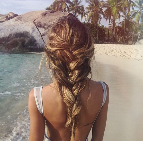 Women walking on a beach with smooth silky hair braids