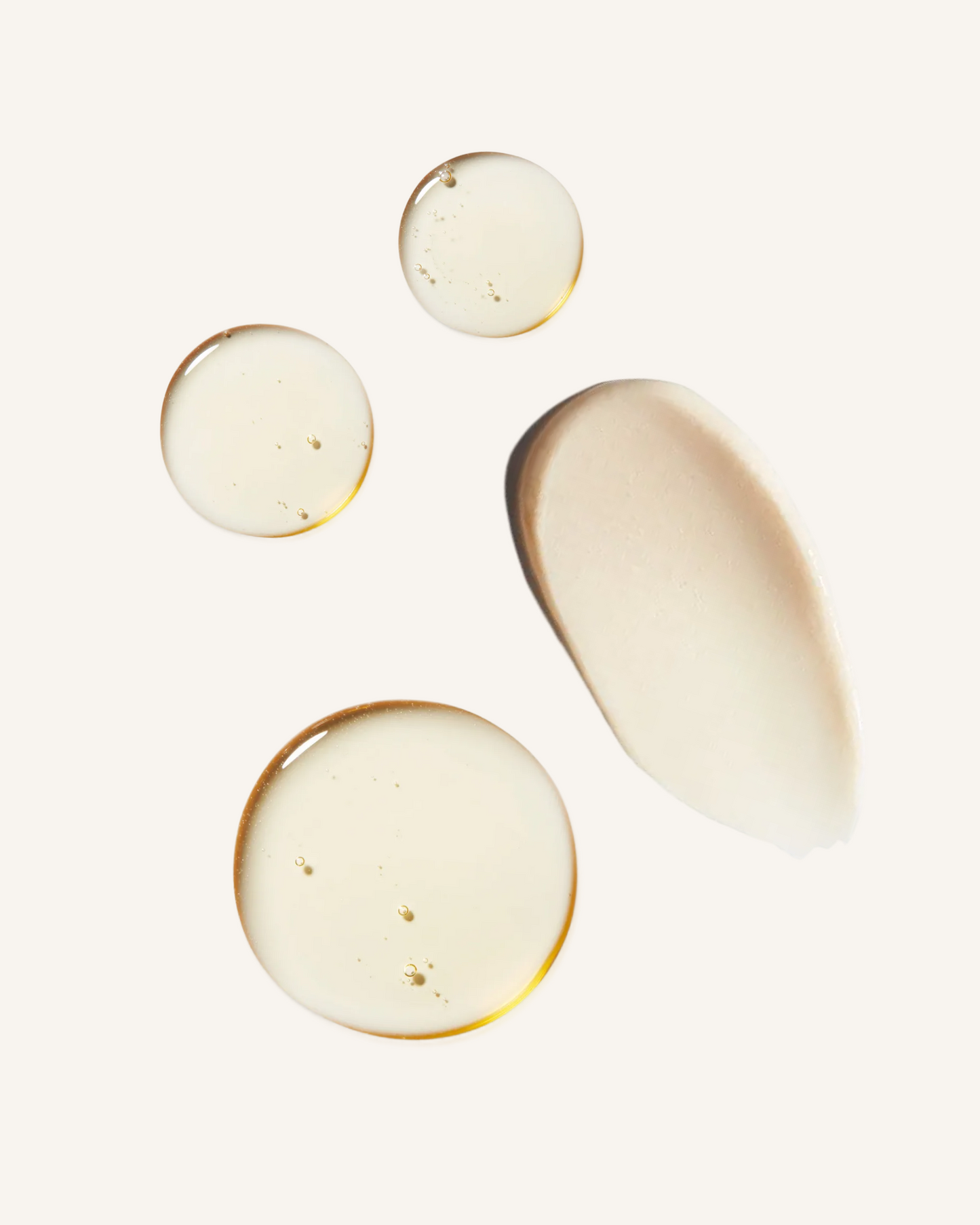 three dots of classic shampoo against a beige background to show the texture with a swipe of thicker classic conditioner beige texture|variant:93-oz