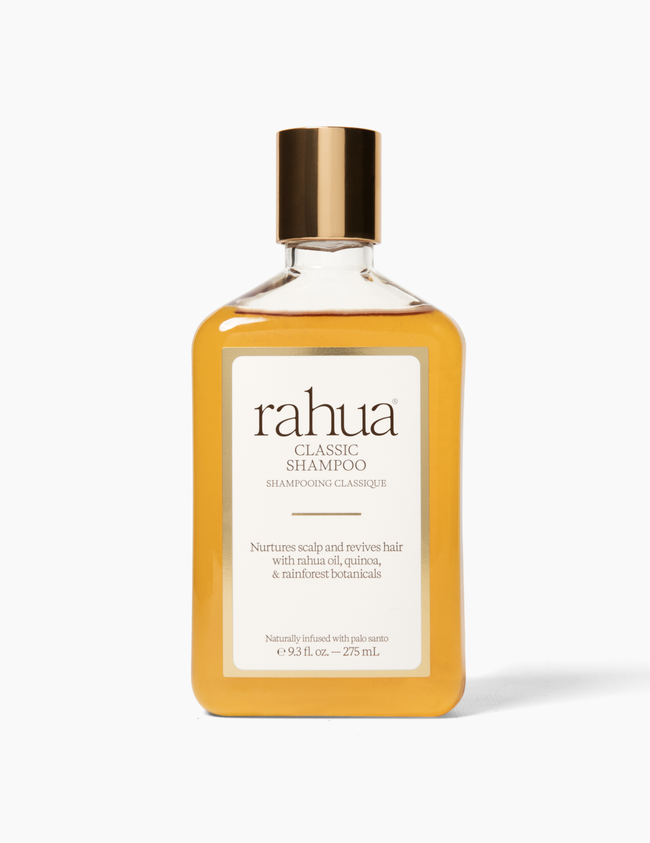 Rahua shampoo bottle with gold cap on a white background|variant:93-oz