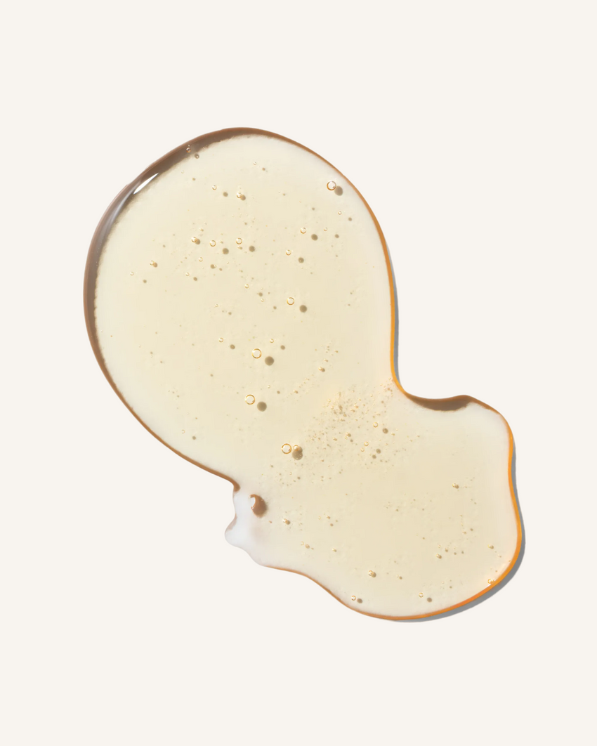 soft pastel orange gel shampoo swatch on an warm white background of rahua enchanted island shampoo|variant:93-oz