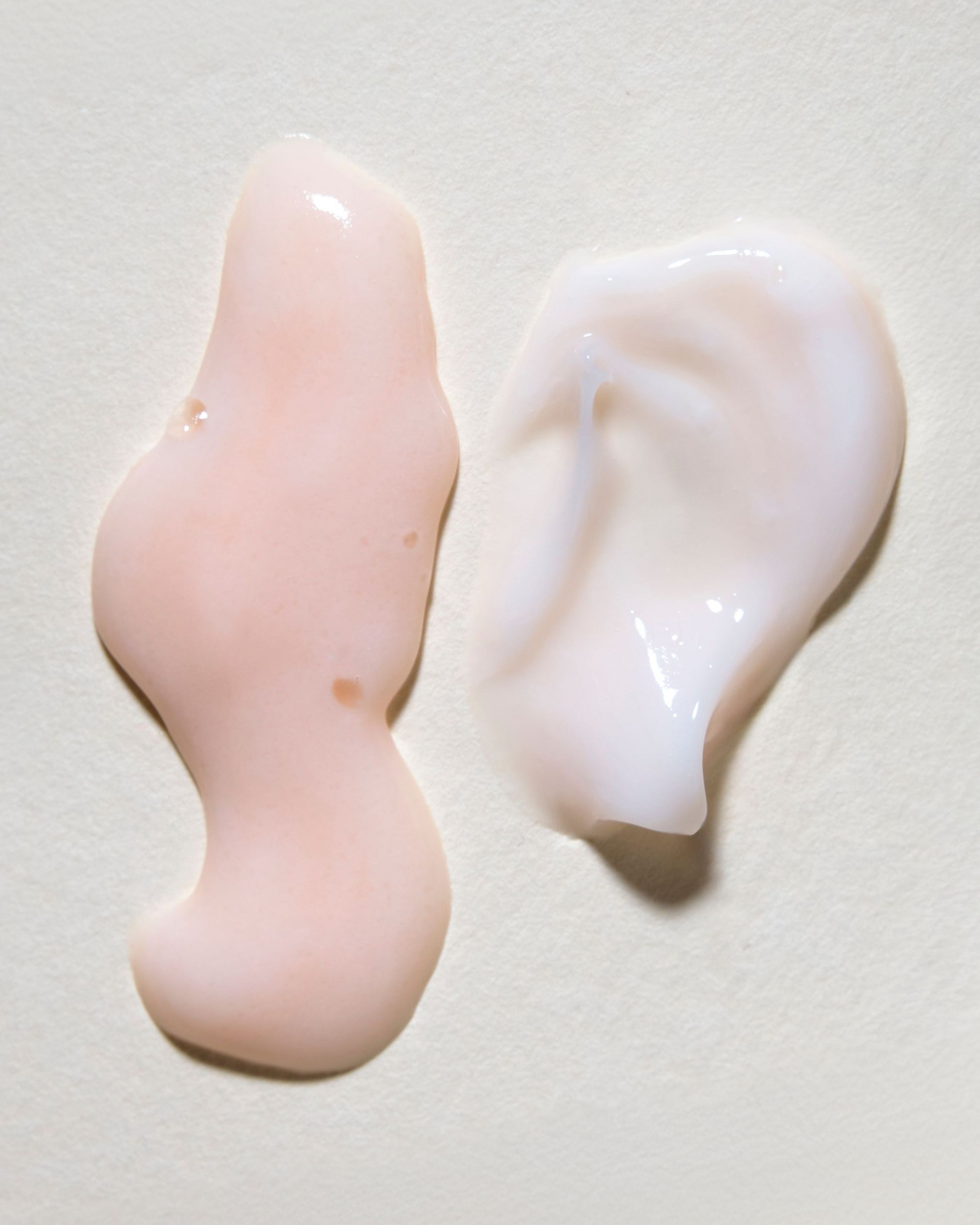 Two silicone ear tips on a light gray background|variant:93-oz,16-oz