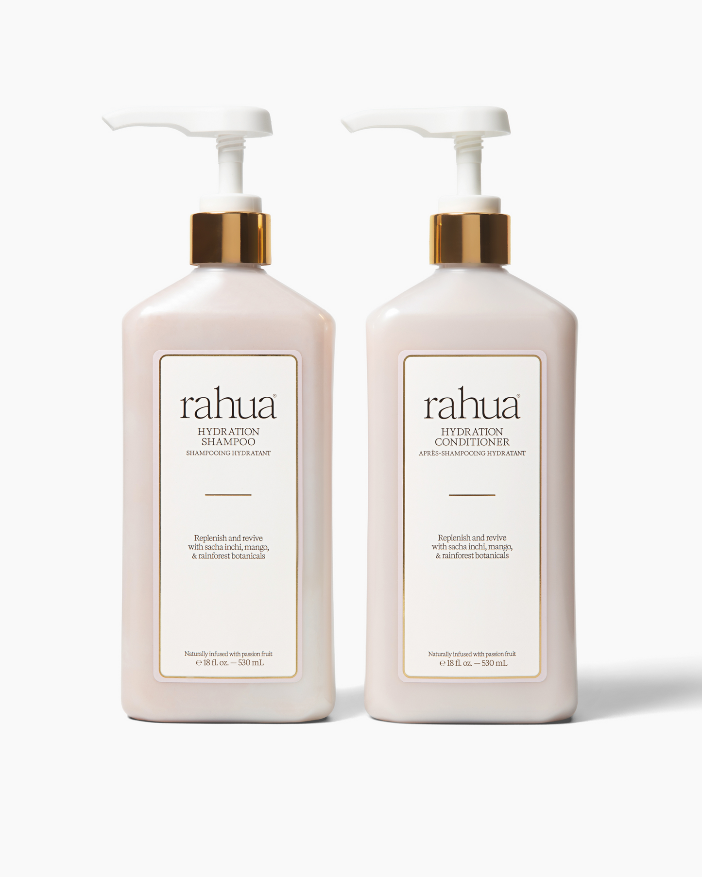 Two bottles of rahua shampoo and conditioner on a white background|variant:16-oz