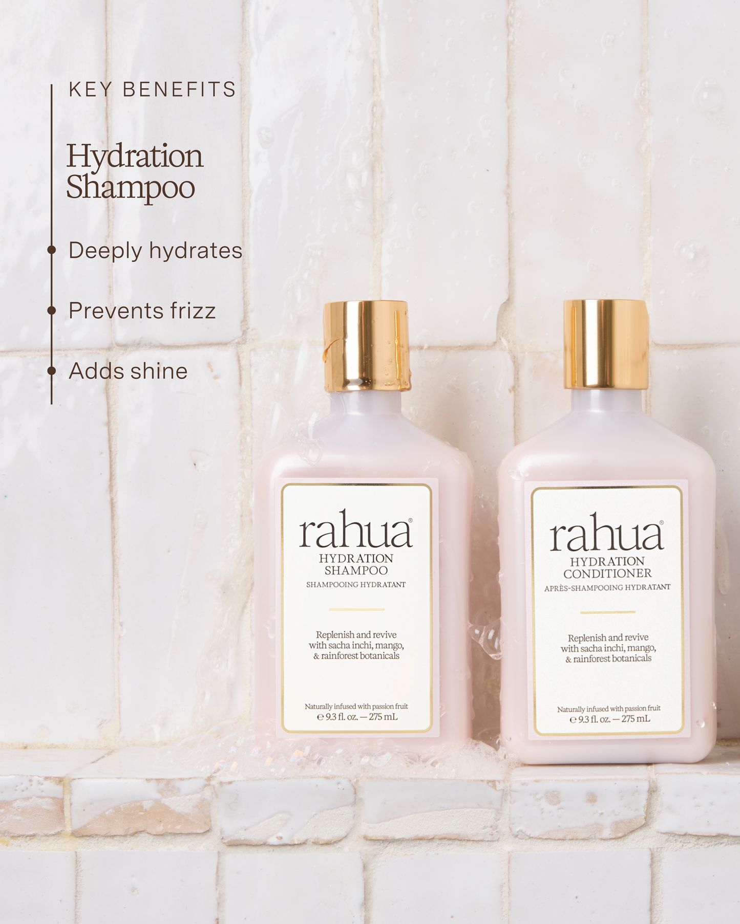 Two bottles of Rahua Hydration Shampoo and Conditioner on a tiled bathroom wall.|variant:93-oz,18-oz,16-oz