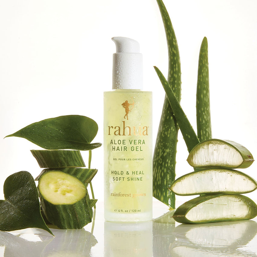 misted over glass bottle of rahua aloe vera hair gel with slices of aloe vera and cucumber on a plain white background|variant:4-oz