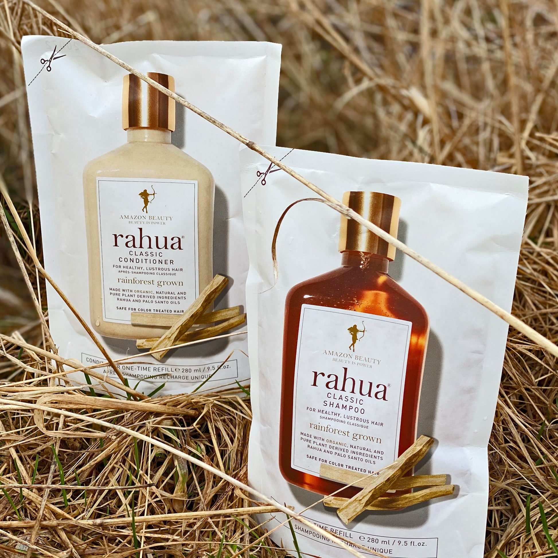 Rahua Classic shampoo refill and classic conditioner refill kept in dry grass