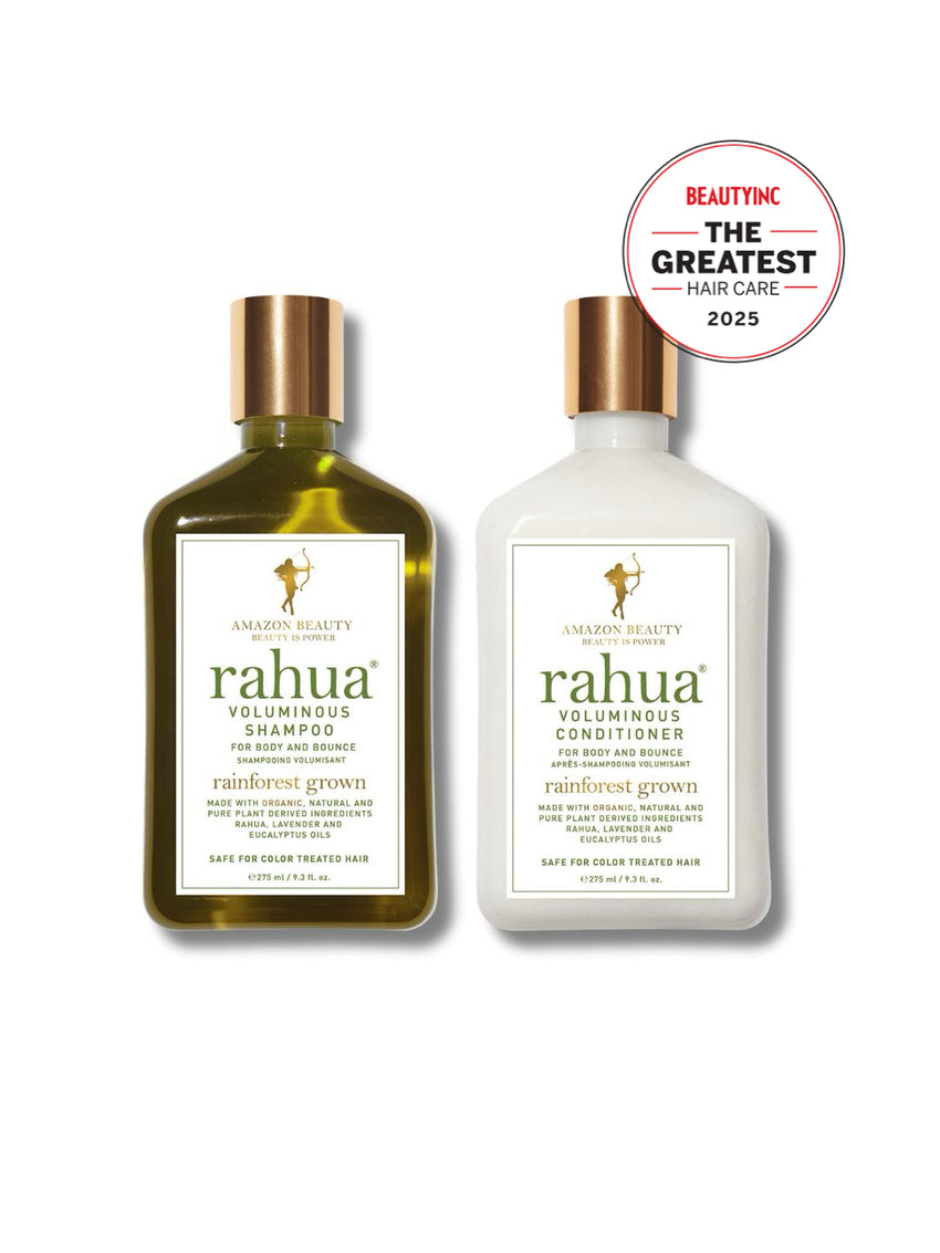 variant:93-oz

two bottles of rahua voluminous shampoo and conditioner with gold caps and white labels with green lettering. there's a sticker in the upper right with "beauty inc. the greatest hair care 2025"