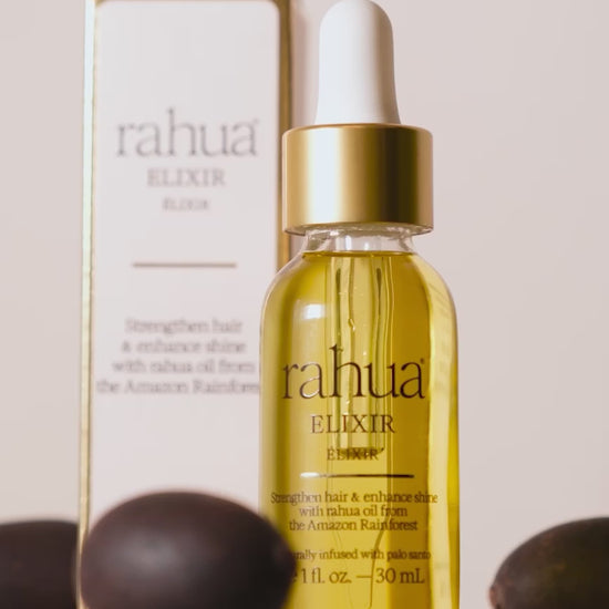 video of rahua elixir with rahua seeds in background, pour overs to show texture of oil|variant:1-oz