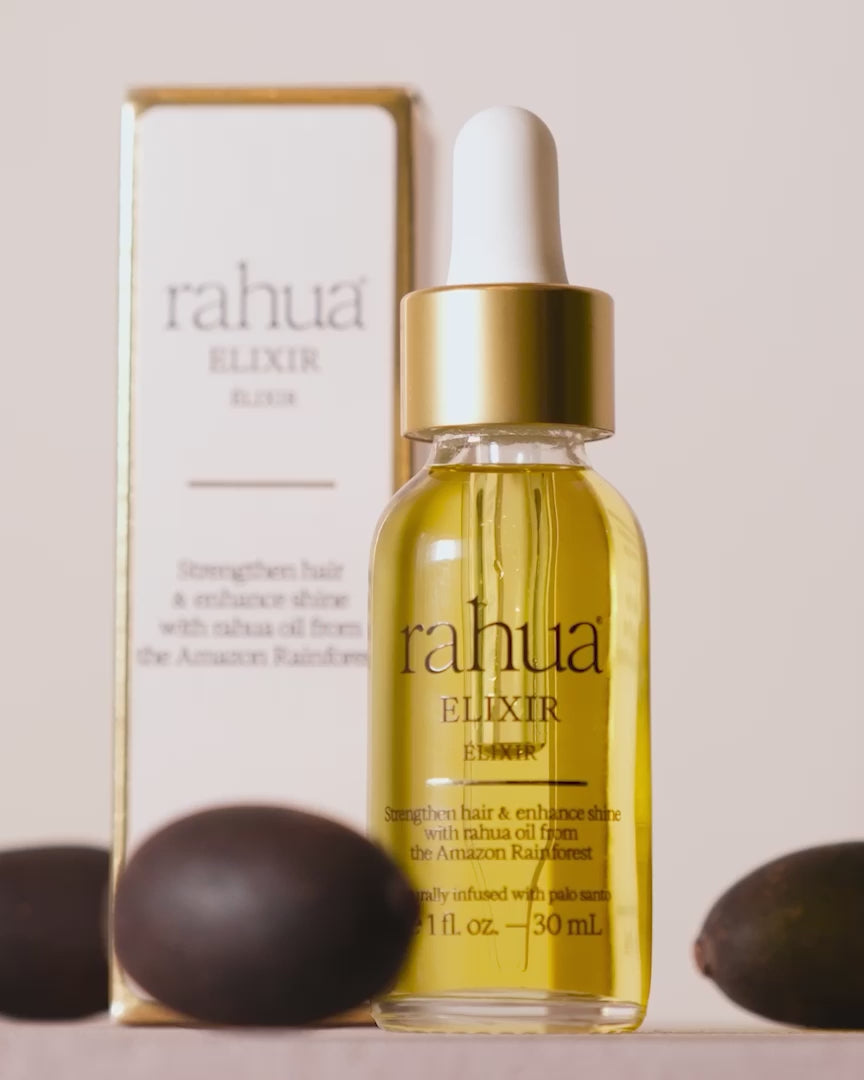 video of rahua elixir with rahua seeds in background, pour overs to show texture of oil|variant:1-oz