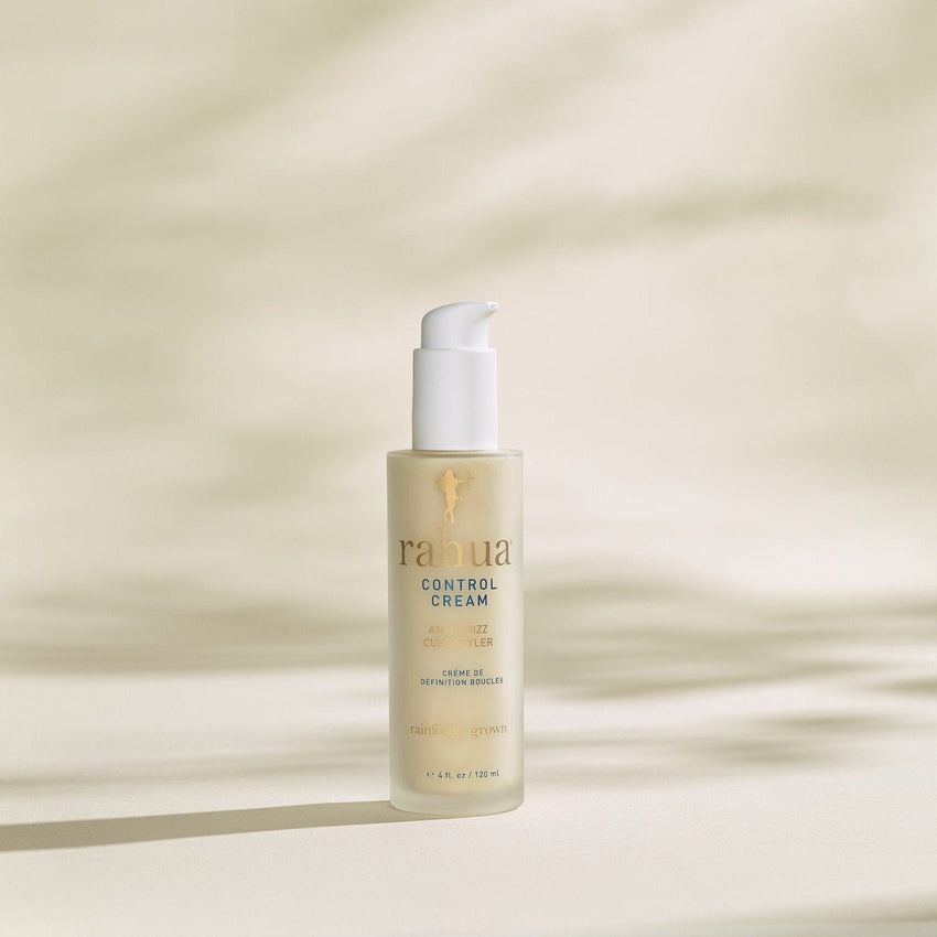 Rahua control cream on a dreamy white beige background with some light shadows