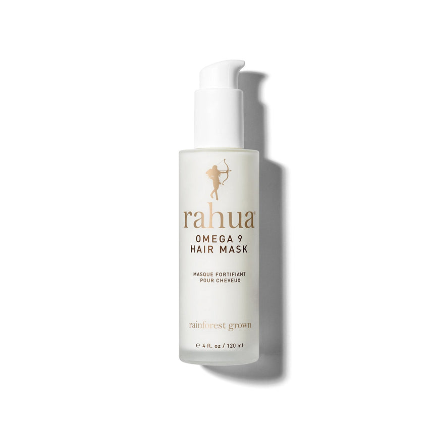 bottle of white product with gold and brown text rahua omega 9 hair mask on a plain white background|variant:4-oz